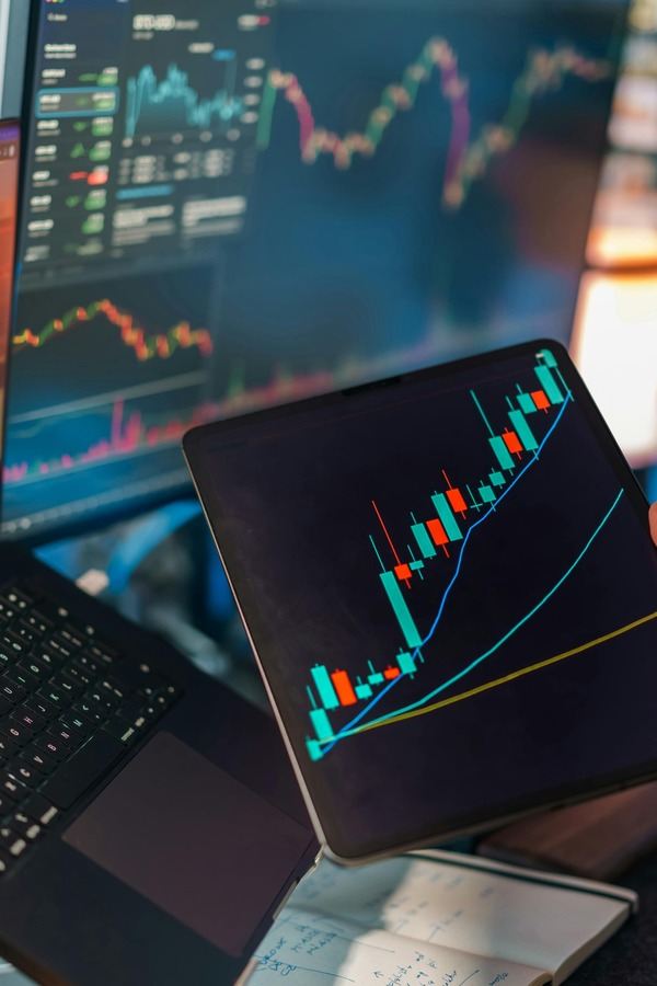 Laptop displaying a candlestick price chart