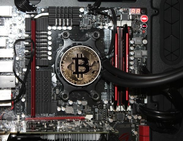 Bitcoin coin placed on a computer motherboard