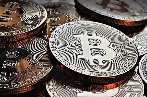 Close-up of silver Bitcoin coins stacked together