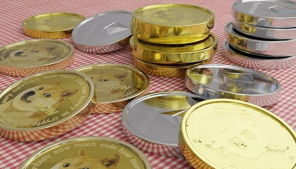 Stacks of gold and silver crypto coins on a table